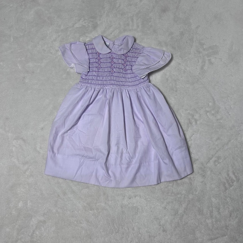 Polly Flinders purple babydoll smocked dress with white trim and bow detail.: 4